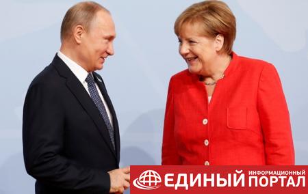 Меркель и Путин обмениваются продуктами